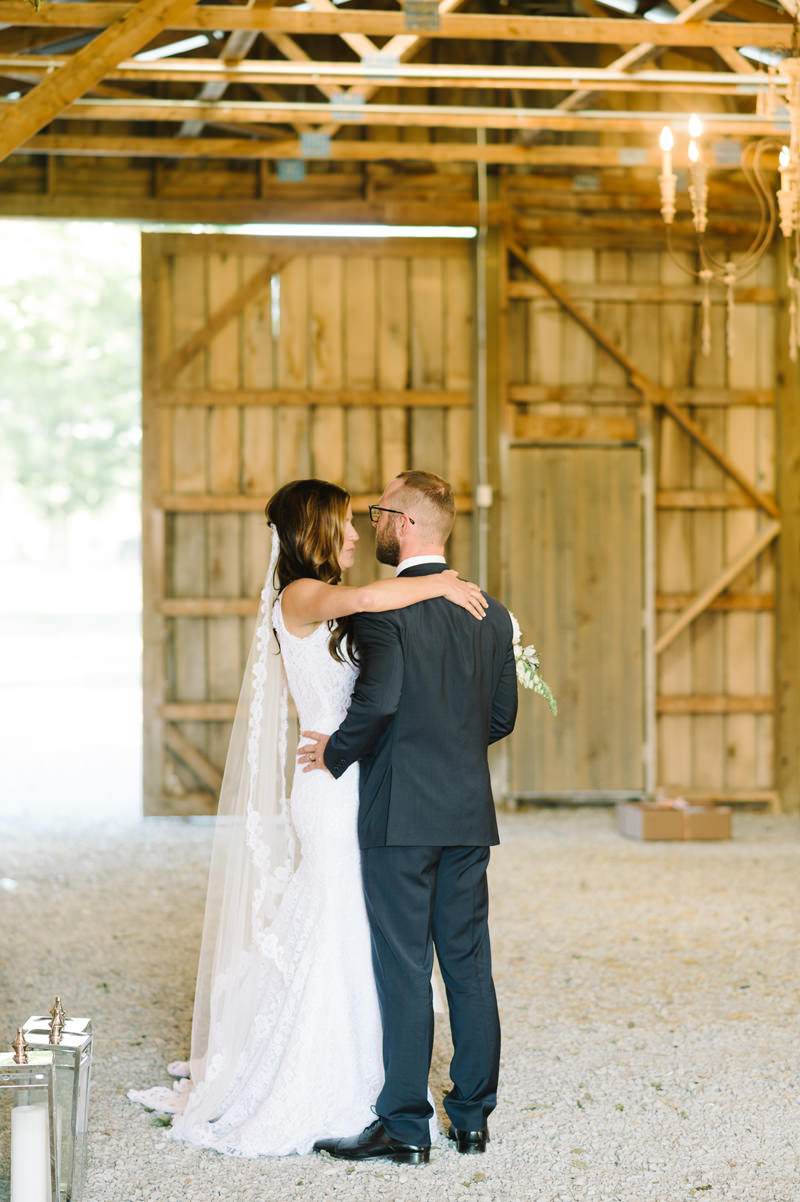 Bride and groom dancing in barn at upcountry venue
