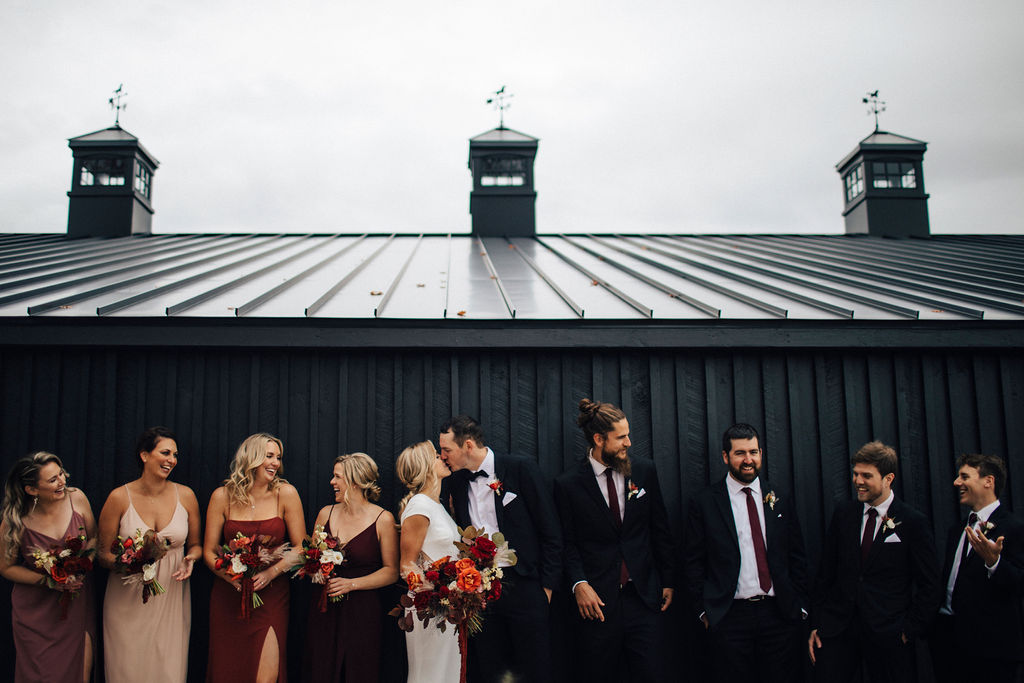 Bride and groom dancing in rustic barn at Upcountry Venue