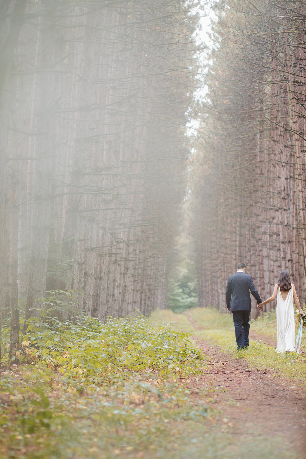 Bride and groom in forest at Braestone Farm